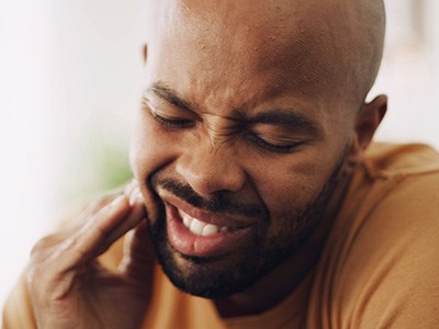 Closeup of man experiencing tooth pain