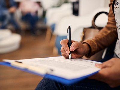 Patient filling out form in lobby