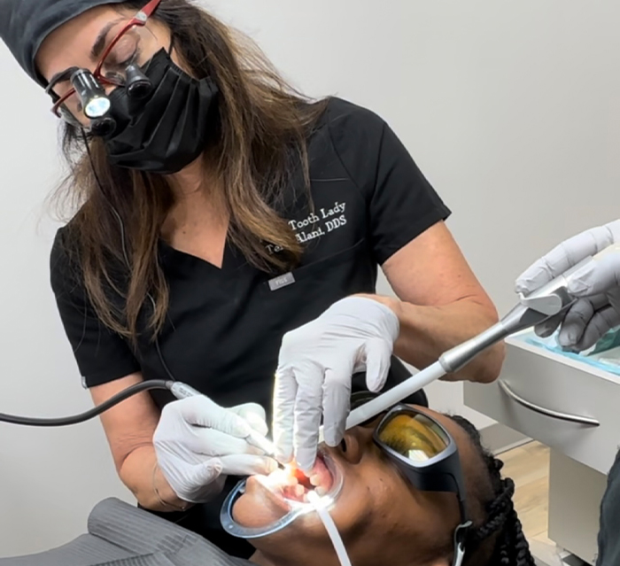 Doctor Alani treating a patient with diode laser dentistry in Houston