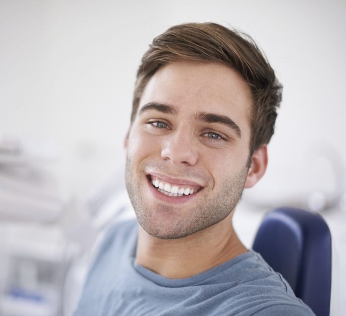 Young man smiling during preventive dentistry visit
