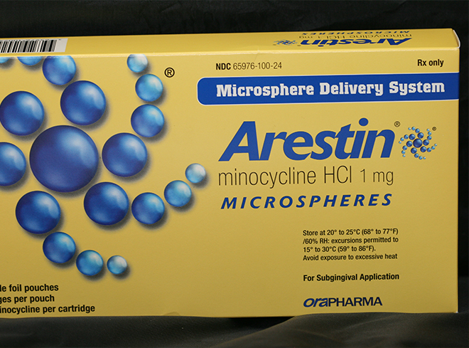 Yellow box for Arestin antibiotic gum disease treatment