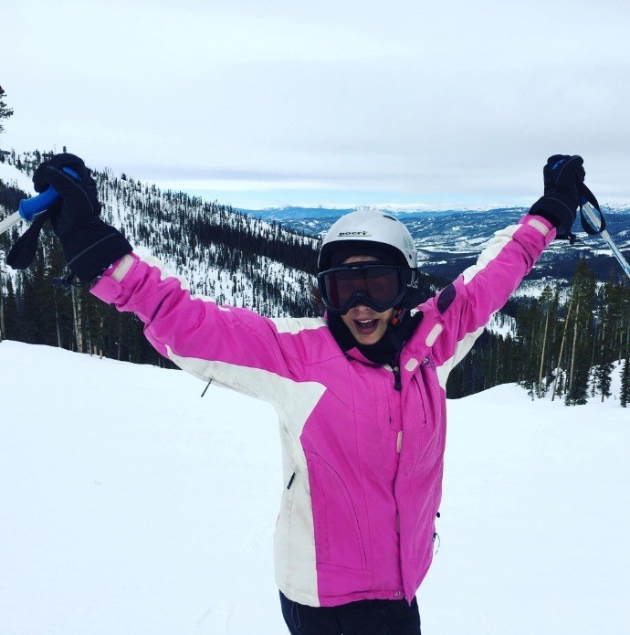 Doctor Alani on ski slope in pink puffy jacket