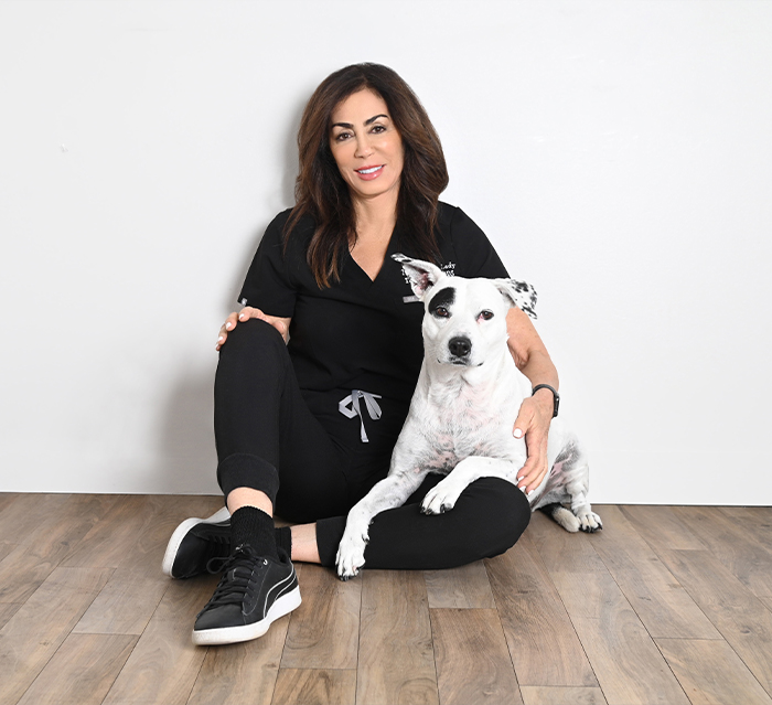 Doctor Terri Alani with Houston dental therapy dog Piper