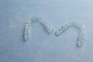 A pair of clear aligners.