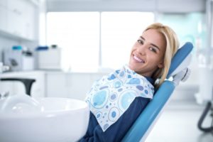 A woman visiting a dentist in Uptown Houston.