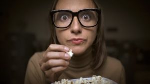 a person eating popcorn in Houston