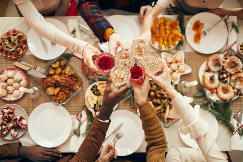 A table of food that could affect your oral health at a holiday gathering 