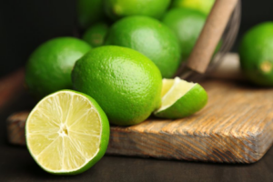 Limes scattered over a cutting board